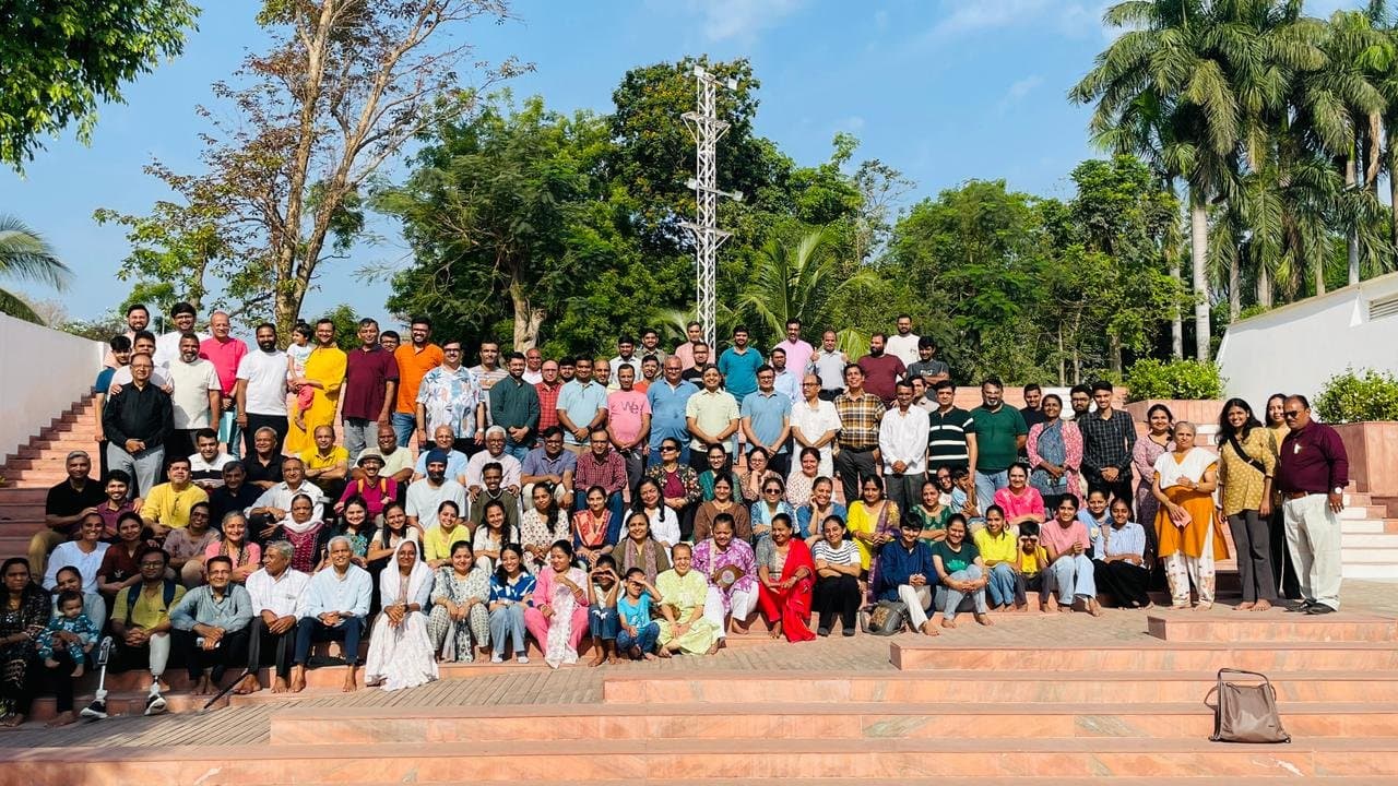 A large group photo gathered on outdoor steps